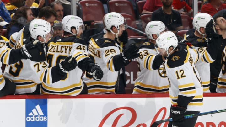 SUNRISE, FL - JANUARY 28: Teammates congratulate Craig Smith #12 of the Boston Bruins after he scored a first period goal against the Florida Panthers at the FLA Live Arena on January 28, 2023 in Sunrise, Florida. (Photo by Joel Auerbach/Getty Images)