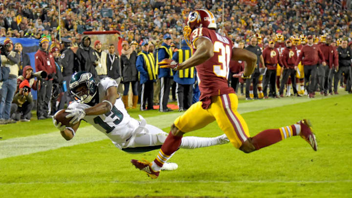 LANDOVER, MD - DECEMBER 30: Nelson Agholor #13 of the Philadelphia Eagles dives for a touchdown in front of Fabian Moreau #31 of the Washington Redskins during the second half at FedExField on December 30, 2018 in Landover, Maryland. (Photo by Will Newton/Getty Images)