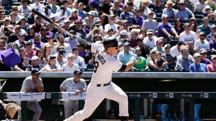Jun 15, 2016; Denver, CO, USA; Colorado Rockies third baseman Nolan Arenado (28) watches his ball on a two run home run in the fifth inning against the New York Yankees at Coors Field. Mandatory Credit: Isaiah J. Downing-USA TODAY Sports