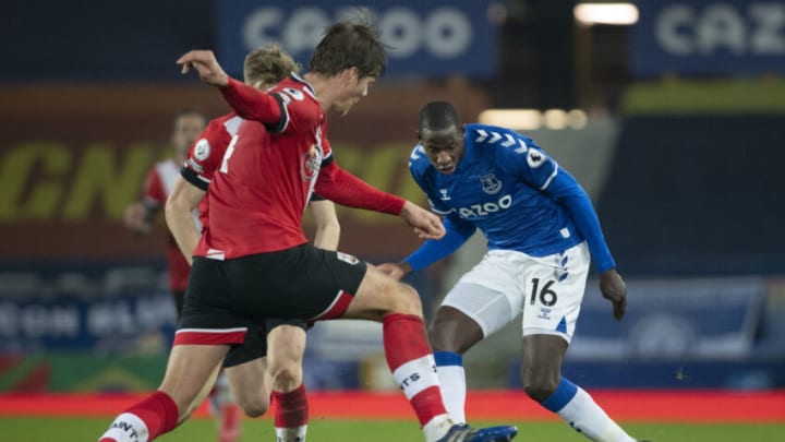 LIVERPOOL, ENGLAND - MARCH 01: Abdoulaye Doucouré of Everton and Jannik Vestergaard of Southampton in action during the Premier League match between Everton and Southampton at Goodison Park on March 1, 2021 in Liverpool, United Kingdom. Sporting stadiums around the UK remain under strict restrictions due to the Coronavirus Pandemic as Government social distancing laws prohibit fans inside venues resulting in games being played behind closed doors. (Photo by Visionhaus/Getty Images)