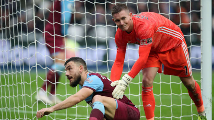 LONDON, ENGLAND - OCTOBER 26: Dean Henderson of Sheffield United with Robert Snodgrass of West Ham United after Snodgrass hits the post late in the game during the Premier League match between West Ham United and Sheffield United at London Stadium on October 26, 2019 in London, United Kingdom. (Photo by Marc Atkins/Getty Images)