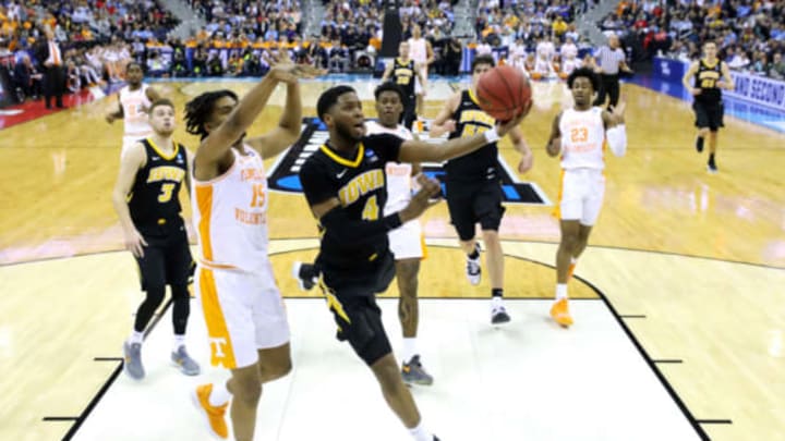 COLUMBUS, OHIO – MARCH 24: Isaiah Moss #4 of the Iowa Hawkeyes goes up for a shot against Derrick Walker #15 of the Tennessee Volunteers during their game in the Second Round of the NCAA Basketball Tournament at Nationwide Arena on March 24, 2019, in Columbus, Ohio. (Photo by Elsa/Getty Images)