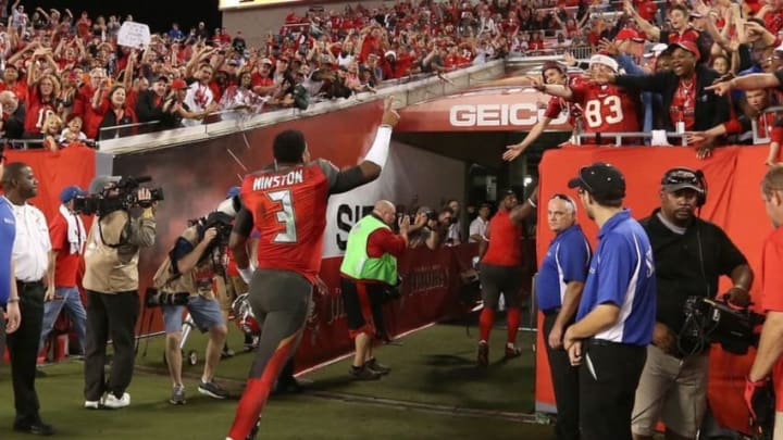 Dec 11, 2016; Tampa, FL, USA; Tampa Bay Buccaneers quarterback Jameis Winston (3) celebrates to the fans as he runs off the field after they beat the New Orleans Saints at Raymond James Stadium. Tampa Bay Buccaneers defeated the New Orleans Saints 16-11. Mandatory Credit: Kim Klement-USA TODAY Sports