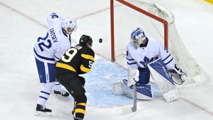 BOSTON, MA - DECEMBER 10: Boston Bruins Left Wing Tim Schaller (59), Toronto Maple Leafs Defenceman Nikita Zaitsev (22), and Toronto Maple Leafs Goalie Frederik Andersen (31) all watch the puck hover in front of the net. During the Boston Bruins game against the Toronto Maple Leafs on December 10, 2016 at TD Bank Garden in Boston, MA. (Photo by Michael Tureski/Icon Sportswire via Getty Images)