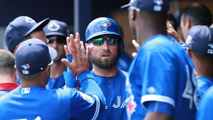 Mar 27, 2016; Port Charlotte, FL, USA; Toronto Blue Jays center fielder Kevin Pillar (11) high fives teammates after scoring a run during the third inning against the Tampa Bay Rays at Charlotte Sports Park. Mandatory Credit: Kim Klement-USA TODAY Sports