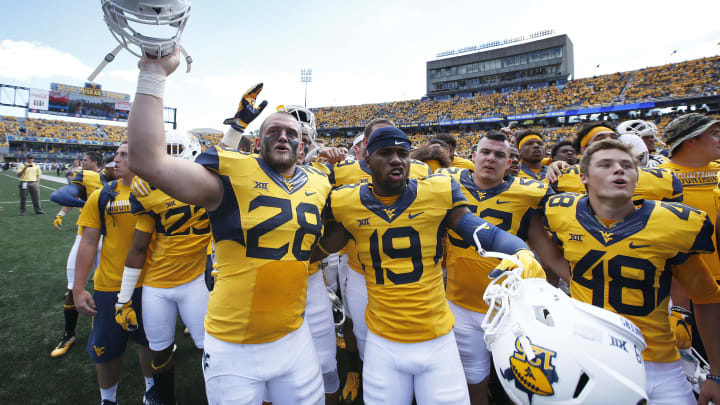 MORGANTOWN, WV – SEPTEMBER 03: West Virginia Mountaineers players celebrate after the game against the Missouri Tigers at Milan Puskar Stadium on September 3, 2016 in Morgantown, West Virginia. West Virginia defeated Missouri 26-11. (Photo by Joe Robbins/Getty Images)
