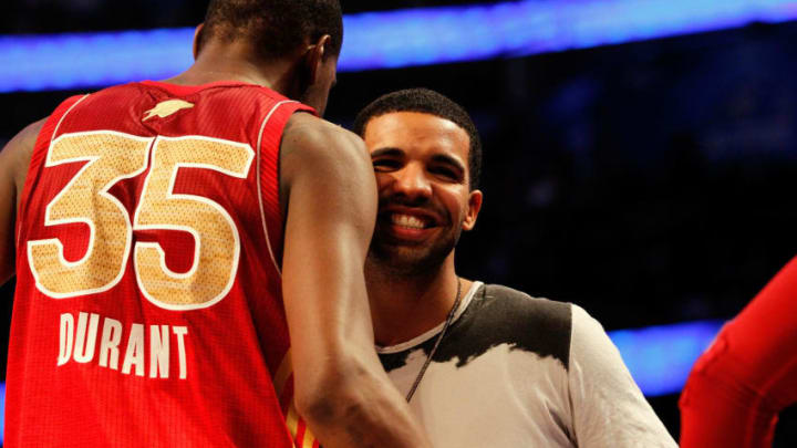 Artist Drake greets former OKC Thunder star Kevin Durant #35 and the Western Conference during the 2012 NBA All-Star Game. (Photo by Ronald Martinez/Getty Images)