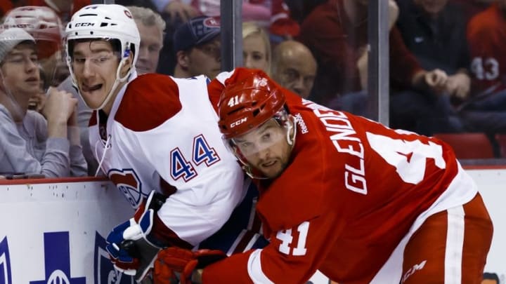 Mar 24, 2016; Detroit, MI, USA; Detroit Red Wings center Luke Glendening (41) checks Montreal Canadiens defenseman Darren Dietz (44) in the third period at Joe Louis Arena. The Red Wings won 4-3. Mandatory Credit: Rick Osentoski-USA TODAY Sports