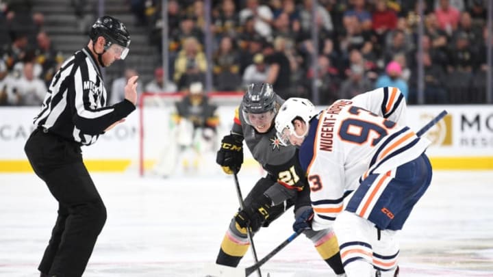 LAS VEGAS, NV - APRIL 01: Cody Eakin #21 of the Vegas Golden Knights faces off with Ryan Nugent-Hopkins #93 of the Edmonton Oilers during the third period at T-Mobile Arena on April 1, 2019 in Las Vegas, Nevada. (Photo by Jeff Bottari/NHLI via Getty Images)