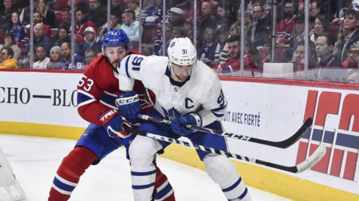 MONTREAL, QC - FEBRUARY 08: Victor Mete #53 of the Montreal Canadiens and John Tavares #91 of the Toronto Maple Leafs chase the puck during the first period at the Bell Centre on February 8, 2020 in Montreal, Canada. (Photo by Minas Panagiotakis/Getty Images)