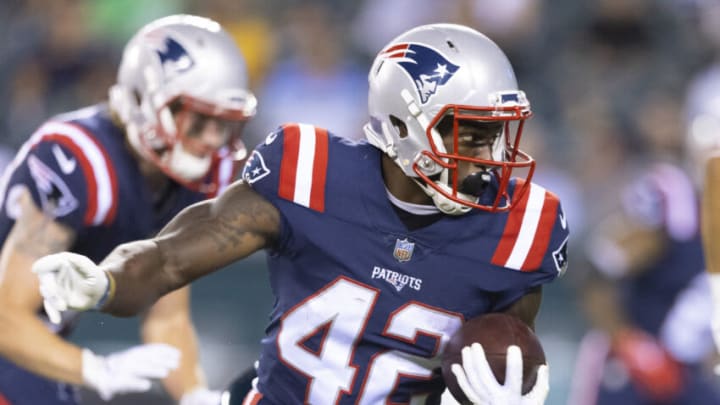 PHILADELPHIA, PA - AUGUST 19: J.J. Taylor #42 of the New England Patriots runs the ball against the Philadelphia Eagles in the second half of the preseason game at Lincoln Financial Field on August 19, 2021 in Philadelphia, Pennsylvania. The Patriots defeated the Eagles 35-0. (Photo by Mitchell Leff/Getty Images)