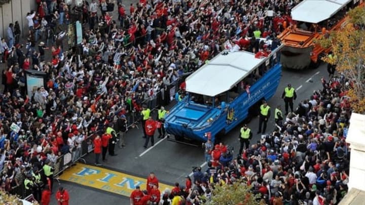 Nov 2, 2013; Boston, MA, USA; An overhead view as duck boats carry Boston Red Sox players across the marathon finish line during the World Series parade as seen from Old South Church in Copley Square. Mandatory Credit: Greg M. Cooper-USA TODAY Sports
