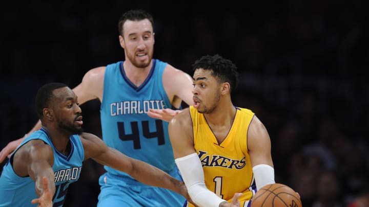 February 28, 2017; Los Angeles, CA, USA; Los Angeles Lakers guard D’Angelo Russell (1) controls the ball against Charlotte Hornets guard Kemba Walker (15) and center Frank Kaminsky III (44) during the first half at Staples Center. Mandatory Credit: Gary A. Vasquez-USA TODAY Sports