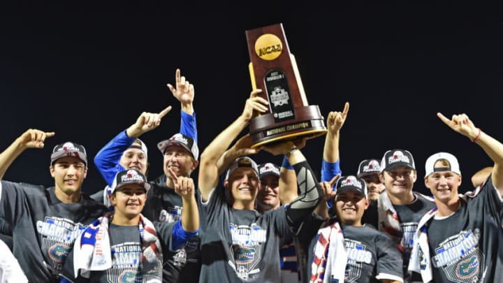 OMAHA, NE - JUNE 27: Players of the Florida Gators hold up the National Championship Trophy after defeating the LSU Tigers 6-1 at the College World Series on June 27, 2017 at TD Ameritrade Park in Omaha, Nebraska. (Photo by Peter Aiken/Getty Images)
