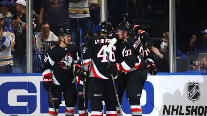 Feb 26, 2023; Buffalo, New York, USA; Buffalo Sabres center Dylan Cozens (24) celebrates his goal with teammates during the first period against the Washington Capitals at KeyBank Center. Mandatory Credit: Timothy T. Ludwig-USA TODAY Sports