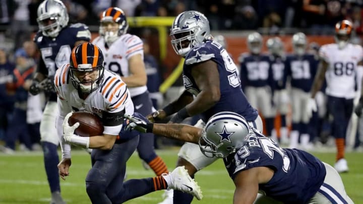 CHICAGO, ILLINOIS - DECEMBER 05: Quarterback Mitchell Trubisky #10 of the Chicago Bears rushes for a touchdown over the defense of defensive end Michael Bennett #79 of the Dallas Cowboys in the fourth quarter of the game at Soldier Field on December 05, 2019 in Chicago, Illinois. (Photo by Jonathan Daniel/Getty Images)