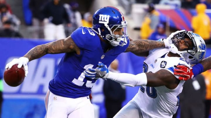 EAST RUTHERFORD, NJ - DECEMBER 18: Odell Beckham #13 of the New York Giants returns a punt against Don Carey #26 of the Detroit Lions during their game at MetLife Stadium on December 18, 2016 in East Rutherford, New Jersey. (Photo by Al Bello/Getty Images)