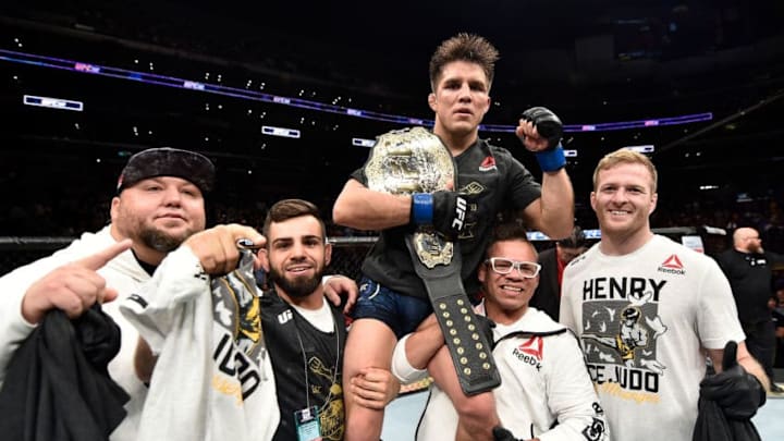 LOS ANGELES, CA - AUGUST 04: Henry Cejudo celebrates after his split-decision victory over Demetrious Johnson in their UFC flyweight championship fight during the UFC 227 event inside Staples Center on August 4, 2018 in Los Angeles, California. (Photo by Jeff Bottari/Zuffa LLC/Zuffa LLC via Getty Images)