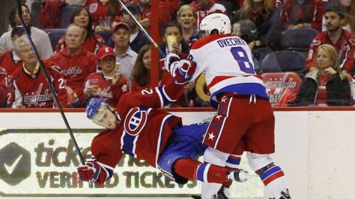 Oct 9, 2014; Washington, DC, USA; Washington Capitals left wing Alex Ovechkin (8) checks Montreal Canadiens left wing Jiri Sekac (26) in the second period at Verizon Center. Mandatory Credit: Geoff Burke-USA TODAY Sports