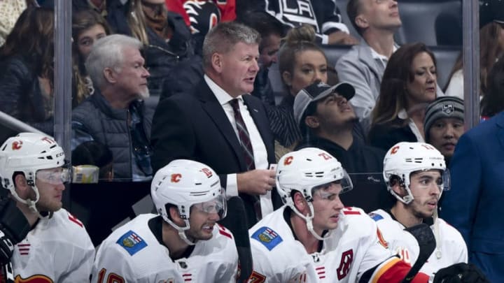 LOS ANGELES, CA - OCTOBER 19: Head coach Bill Peters of the Calgary Flames looks on from the bench during the first period of the game against the Los Angeles Kings at STAPLES Center on October 19, 2019 in Los Angeles, California. (Photo by Adam Pantozzi/NHLI via Getty Images)