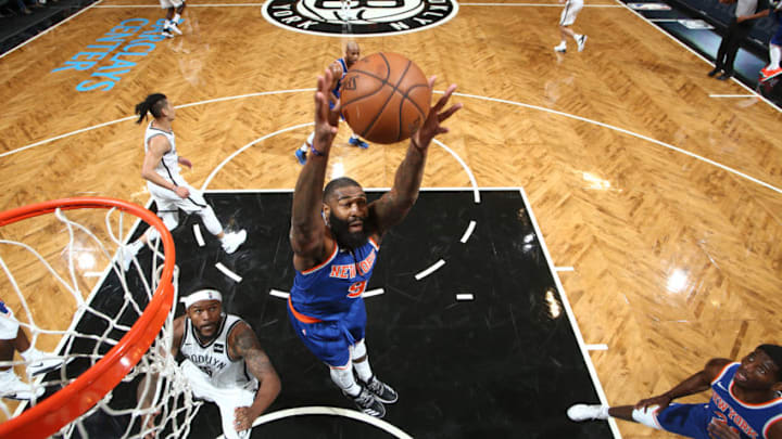 BROOKLYN, NY - OCTOBER 8: Kyle O'Quinn #9 of the New York Knicks grabs the rebound against the Brooklyn Nets during a preseason game on October 8, 2017 at Barclays Center in Brooklyn, New York. Copyright 2017 NBAE (Photo by Nathaniel S. Butler/NBAE via Getty Images)