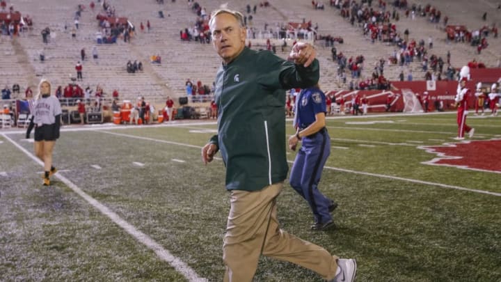 BLOOMINGTON, IN - SEPTEMBER 22: Head coach Mark Dantonio of the Michigan State Spartans runs off the field and acknowledges fans following the win over the Indiana Hoosiers at Memorial Stadium on September 22, 2018 in Bloomington, Indiana. (Photo by Michael Hickey/Getty Images)