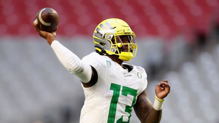 GLENDALE, ARIZONA – JANUARY 02: Quarterback Anthony Brown #13 of the Oregon Ducks throws a pass during the first half of the PlayStation Fiesta Bowl against the Iowa State Cyclones at State Farm Stadium on January 02, 2021 in Glendale, Arizona. (Photo by Christian Petersen/Getty Images)