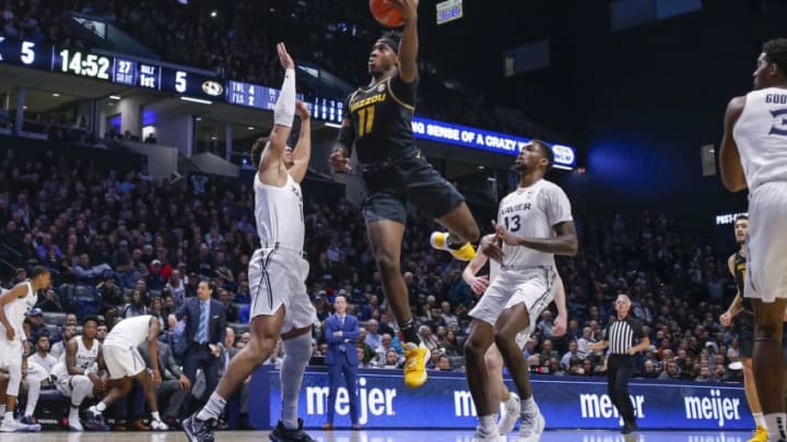 CINCINNATI, OH - NOVEMBER 12: Mario McKinney Jr. #11 of the Missouri Tigers shoots the ball against Paul Scruggs #1 of the Xavier Musketeers during the second half at Cintas Center on November 12, 2019 in Cincinnati, Ohio. (Photo by Michael Hickey/Getty Images)