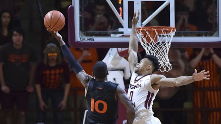 Mar 5, 2016; Blacksburg, VA, USA; Virginia Tech Hokies forward Shane Henry (0) defends the shot attempt of Miami Hurricanes guard Sheldon McClellan (10) in the second half at Cassell Coliseum. Mandatory Credit: Michael Shroyer-USA TODAY Sports