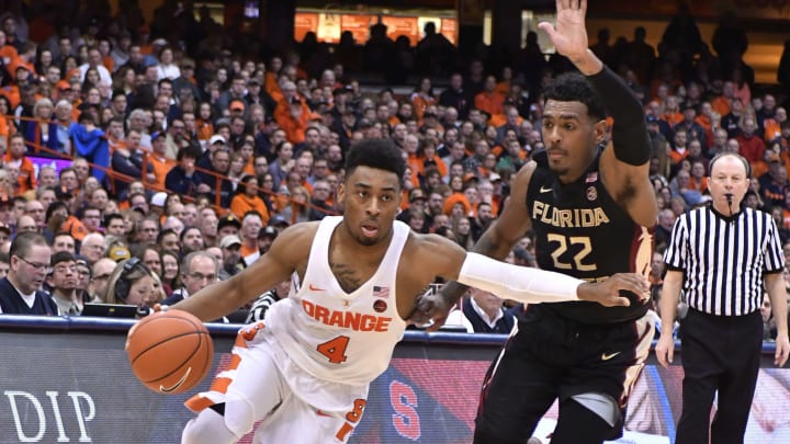 Jan 28, 2017; Syracuse, NY, USA; Syracuse Orange guard John Gillon (4) drives the ball past Florida State Seminoles guard Xavier Rathan-Mayes (22) during the second half of a game at the Carrier Dome. Syracuse won the contest 82-72. Mandatory Credit: Mark Konezny-USA TODAY Sports