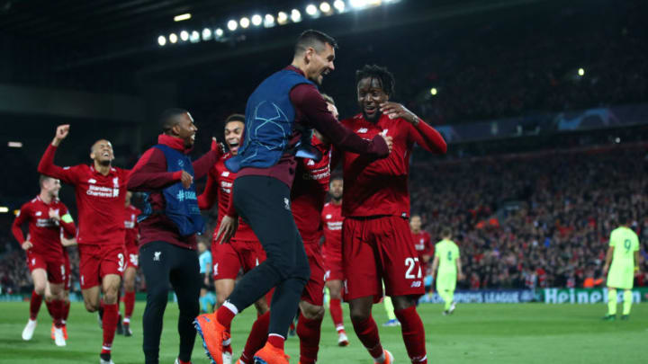 LIVERPOOL, ENGLAND - MAY 07: Divock Origi of Liverpool (27) celebrates as he scores his team's fourth goal with Dejan Lovren and team mates during the UEFA Champions League Semi Final second leg match between Liverpool and Barcelona at Anfield on May 07, 2019 in Liverpool, England. (Photo by Clive Brunskill/Getty Images)