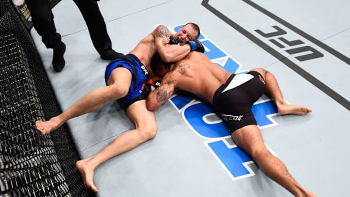 HOUSTON, TX - FEBRUARY 04: (L-R) James Vick attempts to submit Abel Trujillo in their lightweight bout during the UFC Fight Night event at the Toyota Center on February 4, 2017 in Houston, Texas. (Photo by Jeff Bottari/Zuffa LLC/Zuffa LLC via Getty Images)