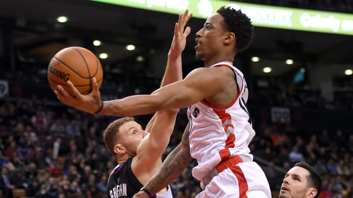 Feb 6, 2017; Toronto, Ontario, CAN; Toronto Raptors guard DeMar DeRozan (10) shoots the ball past Los Angeles Clippers forward Blake Griffin (32) in the fourth quarter at Air Canada Centre. Mandatory Credit: Dan Hamilton-USA TODAY Sports