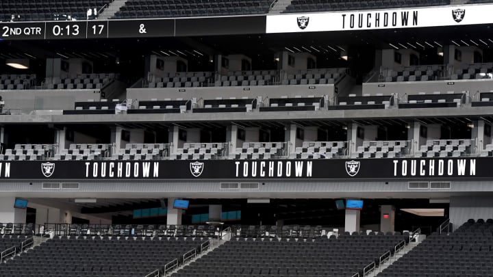 LAS VEGAS, NEVADA – OCTOBER 04: Seats are empty as video screens display a touchdown message after tight end Jason Witten #82 of the Las Vegas Raiders caught a 3-yard touchdown pass from quarterback Derek Carr #4 against the Buffalo Bills in the first half of the NFL game at Allegiant Stadium on October 4, 2020 in Las Vegas, Nevada. NFL games at the stadium will be played without fans in attendance because of the coronavirus (COVID-19) pandemic. The Bills defeated the Raiders 30-23. (Photo by Ethan Miller/Getty Images)