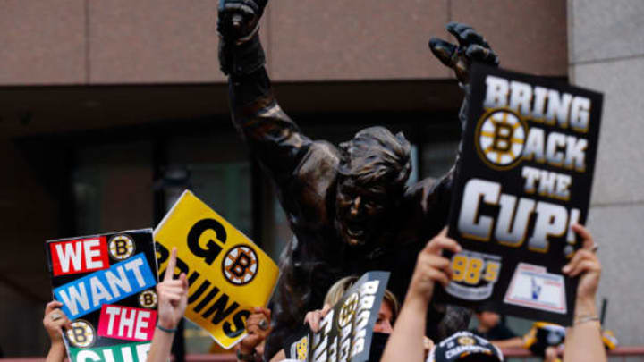 BOSTON, MA – JUNE 24: Fans hold up signs in front of the bobby Orr STatue outside the arena prior to the Boston Bruins hosting the Chicago Blackhawks in Game Six of the 2013 NHL Stanley Cup Final at TD Garden on June 24, 2013 in Boston, Massachusetts. (Photo by Jared Wickerham/Getty Images)