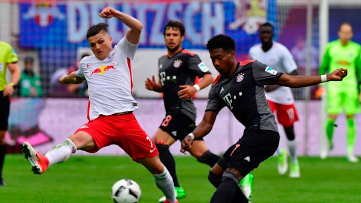 Leipzig's Austrian midfielder Marcel Sabitzer (L) vies with Bayern Munich's Austrian defender David Alaba during the Bundesliga match RB Leipzig vs Bayern Munich in Leipzig on May 13, 2017. Bayern came from behind to win 5 to 4 in the dying minutes of the match. / AFP PHOTO / John MACDOUGALL / RESTRICTIONS: DURING MATCH TIME: DFL RULES TO LIMIT THE ONLINE USAGE TO 15 PICTURES PER MATCH AND FORBID IMAGE SEQUENCES TO SIMULATE VIDEO. == RESTRICTED TO EDITORIAL USE == FOR FURTHER QUERIES PLEASE CONTACT DFL DIRECTLY AT 49 69 650050 (Photo credit should read JOHN MACDOUGALL/AFP/Getty Images)