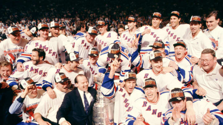 NEW YORK, NY - JUNE 14: The New York Rangers pose with the Stanley Cup Trophy after defeating the Vancouver Canucks in Game 7 of the 1994 Stanley Cup Finals on June 14, 1994 at Madison Square Garden in New York, New York. The Rangers won the series 4 games to 3. (Photo by Bruce Bennett Studios/Getty Images)