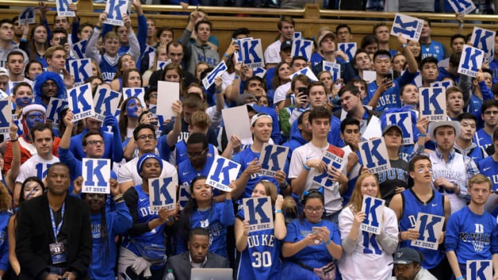 DURHAM, NC - NOVEMBER 11: Cameron Crazies and fans of the Duke Blue Devils hold up signs following the game against the Utah Valley Wolverines at Cameron Indoor Stadium on November 11, 2017 in Durham, North Carolina. Duke won 99-69 and the win gives Mike Krzyzewski his 1,000th victory as Duke's head coach and his 1,073rd overall (73 at Army). (Photo by Lance King/Getty Images)