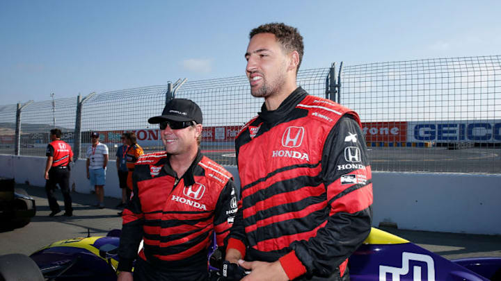 SONOMA, CA - SEPTEMBER 17: Klay Thompson (right) of the Golden State Warriors NBA team meets driver Davey Hamilton after a ride in a two-seat IndyCar on day 3 of the GoPro Grand Prix of Sonoma at Sonoma Raceway on September 17, 2017 in Sonoma, California. (Photo by Lachlan Cunningham/Getty Images)