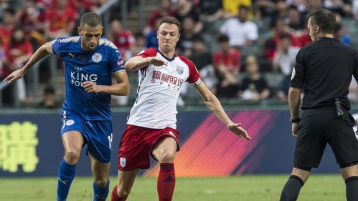 HONG KONG, HONG KONG - JULY 19: Leicester City FC forward Islam Slimani (L) fights for the ball with West Bromwich Albion defender Jonny Evans (R) during the Premier League Asia Trophy match between Leicester City FC and West Bromwich Albion at Hong Kong Stadium on July 19, 2017 in Hong Kong, Hong Kong. (Photo by Victor Fraile/Getty Images)