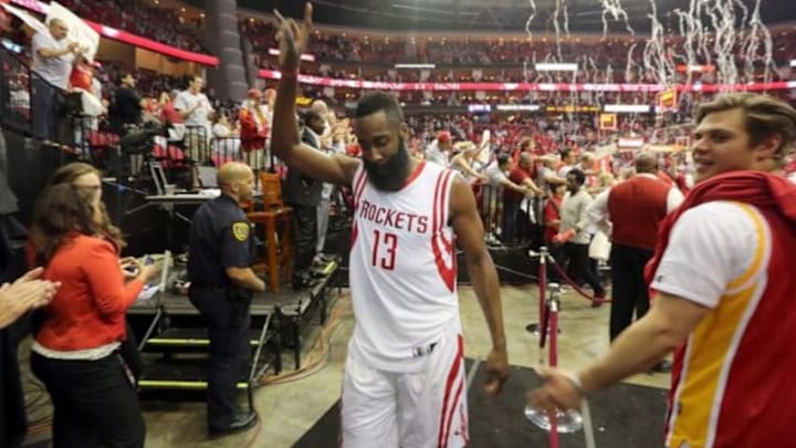 Apr 21, 2015; Houston, TX, USA; Houston Rockets guard James Harden (13) celebrates the win over the Dallas Mavericks in game two of the first round of the NBA Playoffs at Toyota Center. Rockets won 111 to 99. Mandatory Credit: Thomas B. Shea-USA TODAY Sports