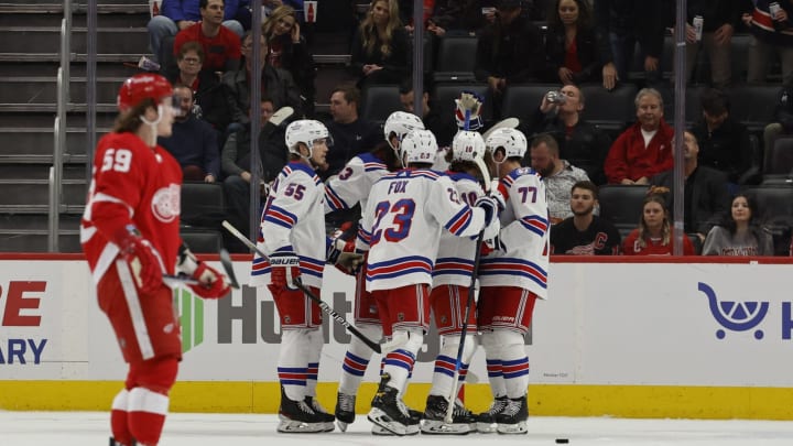 Mar 30, 2022; Detroit, Michigan, USA; New York Rangers left wing Artemi Panarin (10) celebrates with teammates after scoring in the second period against the Detroit Red Wings at Little Caesars Arena. Mandatory Credit: Rick Osentoski-USA TODAY Sports