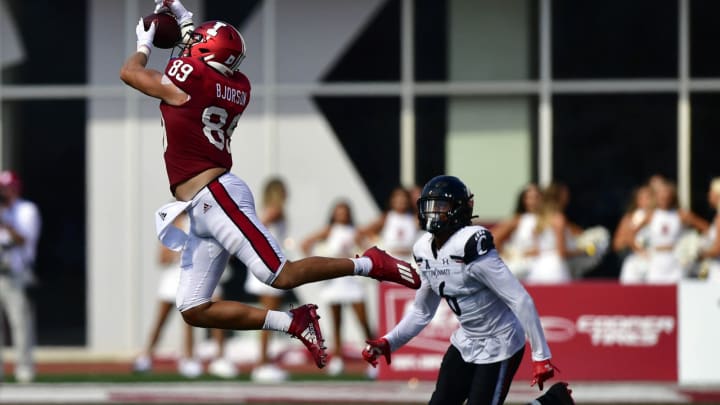 Sep 18, 2021; Bloomington, Indiana, USA; Indiana Hoosiers tight end Matt Bjorson (89) jumps in an attempt to catch a pass in front of Cincinnati Bearcats safety Bryan Cook (6) in the last minutes of the game at Memorial Stadium. Bearcats won 38-24. Mandatory Credit: Marc Lebryk-USA TODAY Sports