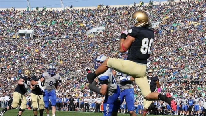 Oct 8, 2011; South Bend, IN, USA; Notre Dame Fighting Irish tight end Tyler Eifert (80) catches the ball in the end zone for a touchdown against the Air Force Falcons at Notre Dame Stadium. Mandatory Credit: Brian Spurlock-USA TODAY Sports