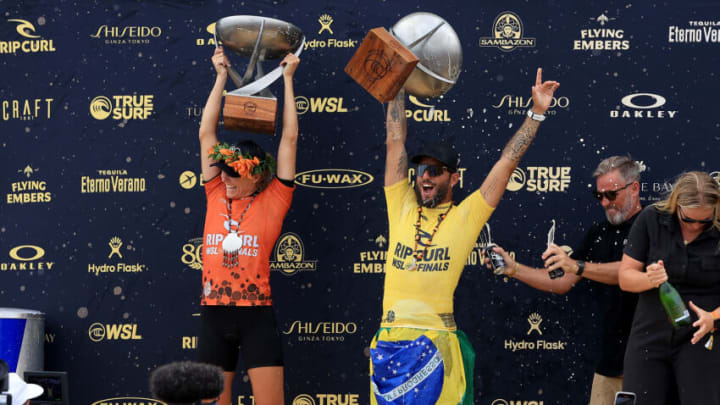SAN CLEMENTE, CALIFORNIA - SEPTEMBER 08: Stephanie Gilmore of Austrlalia and Felipe Toledo celebrate after being named World champions after finishing first place in the Ripcurl WSL Finals at Lower Trestles on September 08, 2022 in San Clemente, California. (Photo by Sean M. Haffey/Getty Images)