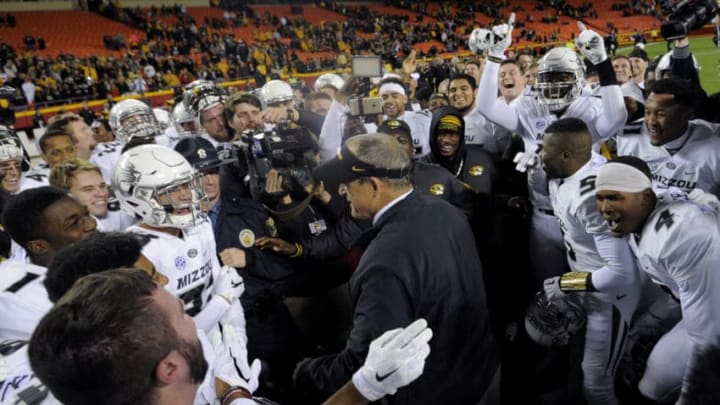 KANSAS CITY, MO - NOVEMBER 14: Head coach Gary Pinkel of the Missouri Tigers celebrates with members of his team after a 20-16 win over the Brigham Young Cougars at Arrowhead Stadium on November 14, 2015 in Kansas City, Missouri. (Photo by Ed Zurga/Getty Images)