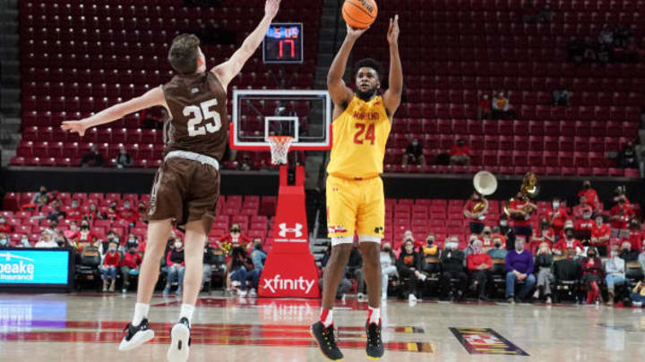 COLLEGE PARK MARYLAND - DECEMBER 28: Donta Scott #24 of the Maryland Terrapins takes a shot over Ben Knostman #25 of the Lehigh Mountain Hawks during a college basketball game at the Xfinity Center on December 28, 2021 in College Park, Maryland. (Photo by Mitchell Layton/Getty Images) COLLEGE PARK MARYLAND - DECEMBER 28: Donta Scott #24 of the Maryland Terrapins takes a shot over Ben Knostman #25 of the Lehigh Mountain Hawks during a college basketball game at the Xfinity Center on December 28, 2021 in College Park, Maryland. (Photo by Mitchell Layton/Getty Images)