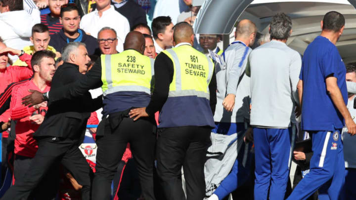 LONDON, ENGLAND - OCTOBER 20: Stewards hold back Jose Mourinho, Manager of Manchester United Chelsea assistant Marco Ianni makes his way towards the tunnel during the Premier League match between Chelsea FC and Manchester United at Stamford Bridge on October 20, 2018 in London, United Kingdom. (Photo by Catherine Ivill/Getty Images)