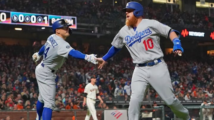SAN FRANCISCO, CA - APRIL 29: Justin Turner #10 of the Los Angeles Dodgers is congratulated by Enrique Hernandez #14 after Turner scored against the San Francisco Giants in the top of the sixth inning of a Major League Baseball game at Oracle Park on April 29, 2019 in San Francisco, California. (Photo by Thearon W. Henderson/Getty Images)