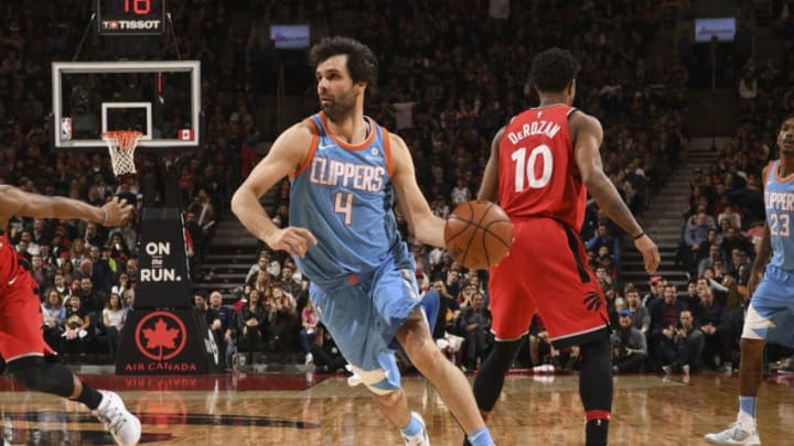 TORONTO, CANADA - MARCH 25: Milos Teodosic #4 of the LA Clippers handles the ball against the Toronto Raptors on March 25, 2018 at the Air Canada Centre in Toronto, Ontario, Canada. NOTE TO USER: User expressly acknowledges and agrees that, by downloading and or using this Photograph, user is consenting to the terms and conditions of the Getty Images License Agreement. Mandatory Copyright Notice: Copyright 2018 NBAE (Photo by Ron Turenne/NBAE via Getty Images)